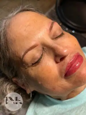 Student practicing precise facial brow mapping and symmetry balance during permanent makeup classes near me in Lakeland FL